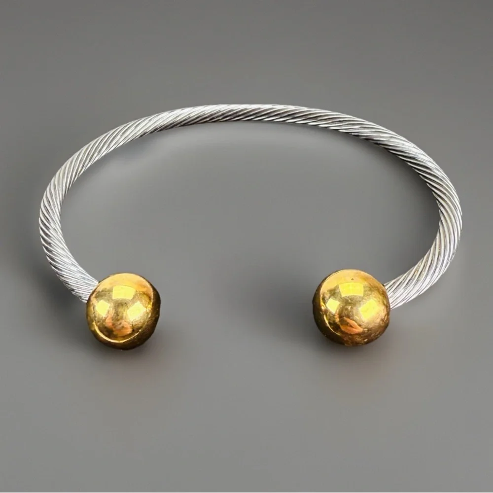Pretty silvertone and goldtone, twisted cuff bracelet